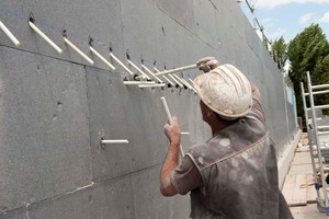  The insulation boards were glued to the load-bearing concrete wall and bore holes were placed for a total of 920 Thermoankers 