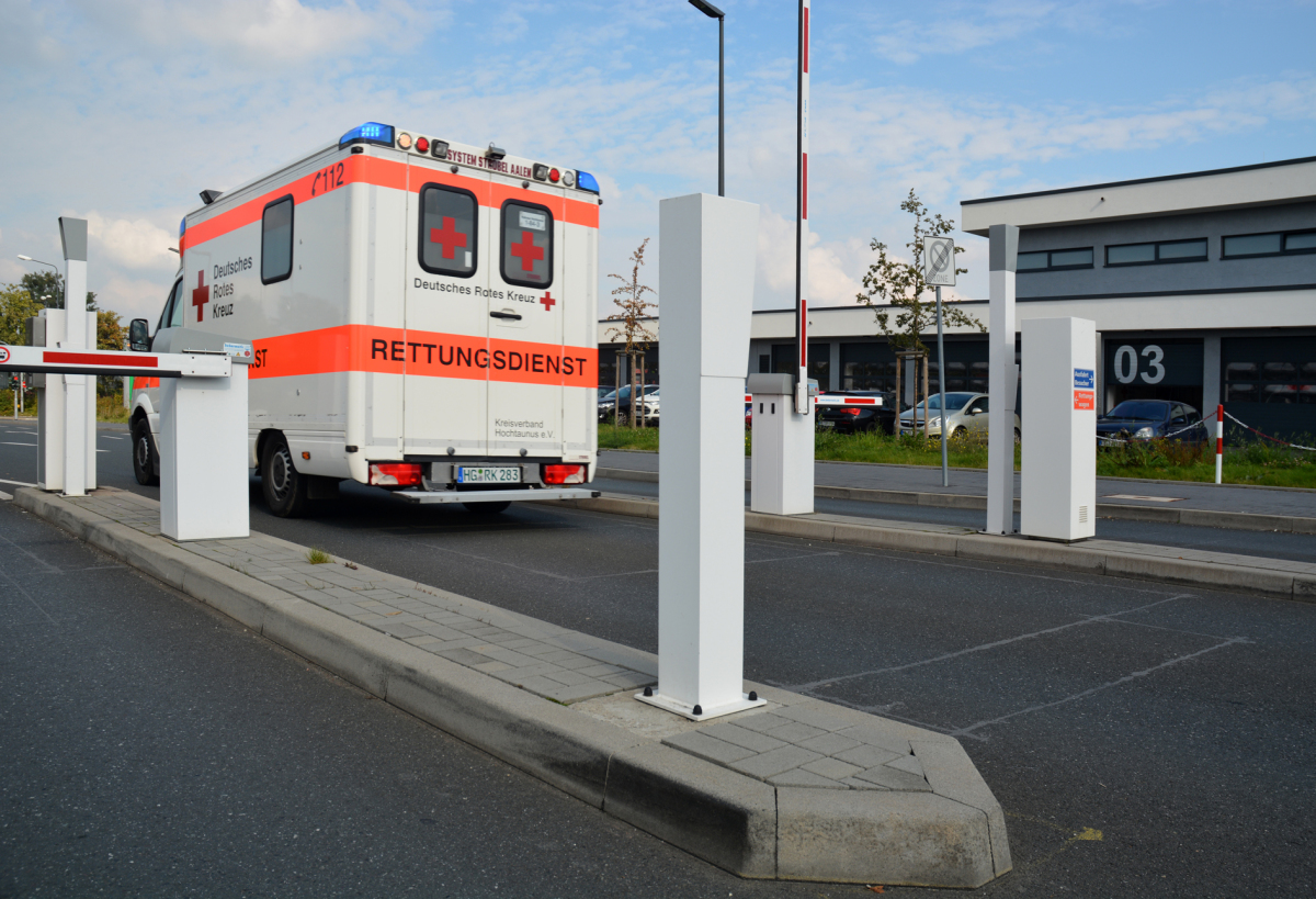 Small traffic island made of standard corner curbstones Concrete