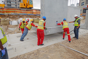  L-shaped units are lowered onto the mass foundation 