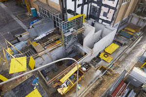  The open stair core with sculptural appearance supports parts of the column-free suspended ceiling made from wood. Its construction faced the engineer and architect with some challenges  