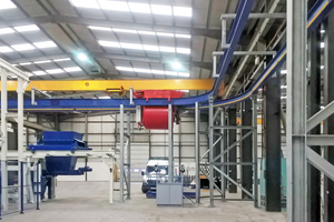  Flying bucket approaching a discharge station on production machine under construction 