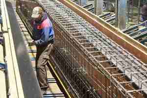  Preparing of concrete placement on the 60m long casting bed for prestressed concrete girders; ...  