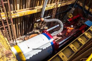  Installing, laying the concrete pipes at the construction site  