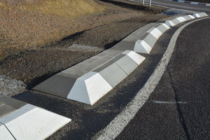  The road surfaces are drained via open curbs into the adjacent unpaved ground  