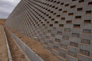  A close-up of an attenuation-pond closed-face wall which was built using MVA 7 retaining wall blocks and Slider Panels 