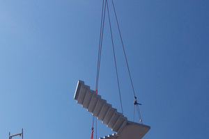  Lifting a precast folded stair into the building core 