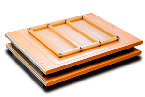  Fig. 1: Assembly group consisting of Wasa Wooplast supporting board with feet and standalone polyurethane mold. This triple mold is screwed onto the supporting board by means of metal sleeves. Their position facilitates molding of the concrete blocks using a vacuum robot. 