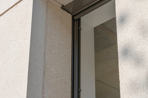  The striking façade grid features narrow window openings  