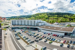  The curved lines of the building fit harmoniously into the surrounding hilly terrain 