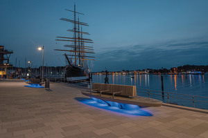  The benches illuminate in a blue light at night  