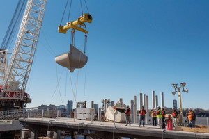  Placement of one of the 132 tulip-shaped precast concrete planters on the prestressed concrete piles driven into the ground  