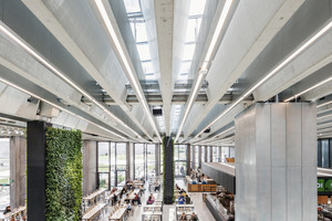  The roof structure visible in the interior is characterized by the narrow skylights and the V-shaped precast exposed concrete elements 