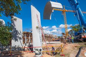  One of the large arches is lowered into position on the main entrance arch  