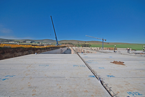  Two rows of precast beams with exposed beam rebar for tying into the structural topping 