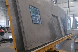  The complete walls are transported out of the hall on commissioned transport racks 