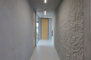  The closed interior wall surfaces are also precast elements whose surfaces were created with textured formliners 