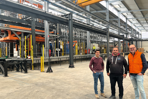  Members of the technical management in front of the plant for prefabricating manhole bases 