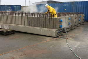  Following tensioning, the prestressed concrete beams were blasted with high-pressure water to improve bonding of the next supplemental concrete layer  
