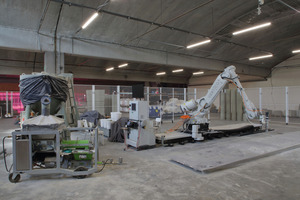  The 3D printing setup also includes a mixer (front left) and a silo for the dry mortar (pictured behind)  