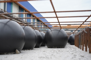  The innovative Bubbledeck slab system removes excess weight by using plastic bubbles as voids within the floor slab  