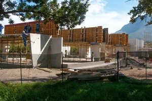  Shuttering for the in-situ roof slabs straddles the U-shaped precast concrete elements 