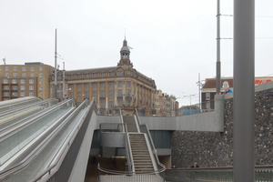  Access to the parking garage is provided through three moving belts running in parallel and a centrally placed cascade of stairs 