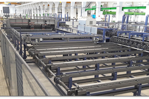  View of a PL XY AMM machine with two moving, multi-point welding heads  