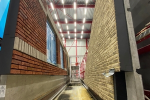  Almost finished precast wall element with integrated thermal insulation and brick slip facade. The joints between the brick slips are subsequently filled with mortar.  