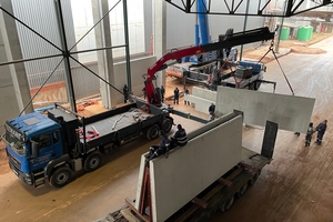  A precast panel is offloaded prior to installation in the strip section 