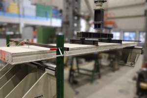  Fig. 1: Deconstructed prestressed concrete hollow-core slab in the test rig [1]  