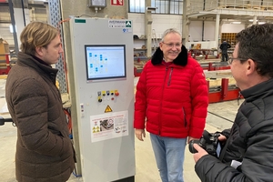  ... and guided his guests through the new factory building 