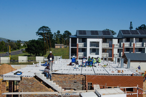  An apartment block under construction showing a precast concrete staircase and the first-floor hollow-core slab flooring 