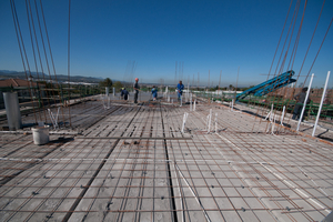  A 75mm layer of reinforced concrete is laid over a section of hollow-core slab flooring as per KLS Engineers design 