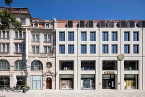  Shadow gaps make the architectural concrete façade composed of acid-washed prefabricated panels blend into the surrounding historic city center  