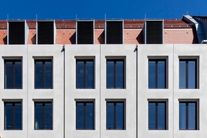  Dormers accommodating building services blend into the roofscape and align with the façade grid  