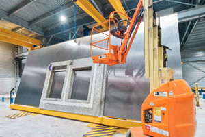  Fig. 3: The tilting unit installed in the new building moves finished wall panels into a vertical position and thus allows for safe and user-friendly removal 