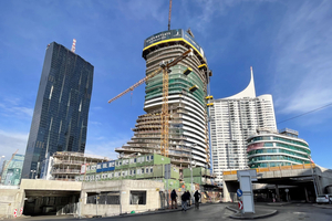  Following the four-story base section of the building, the stories of the residential tower are developing upwards in a gently curve 