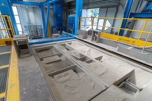  Fig. 2: The cement paste is applied layer by layer to the sand bed by a print head  