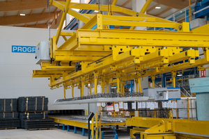  Fig. 6: The lifting traverse removes the finished element from the pallet and prepares it for onward transport  