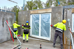  Fig. 5: The prefabricated exterior wall with an integrated window was positioned on the construction site and connected to the adjacent components  