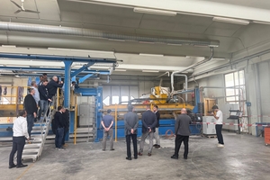  Fig. 3: During the guided tour of 3D concrete printing, participants were able to view the SPI (Selective Paste Intrusion) printer and various exhibits produced using it 