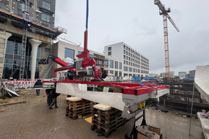  Fig. 9: The individual facade elements are lifted using a specially designed vacuum lifting device  