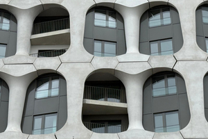  Fig. 4: The glass-fiber-reinforced concrete facade elements extend over two stories and frame the windows and loggias  