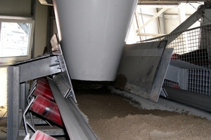  Two conveyor belts deliver the no-slump concrete to the block machine  