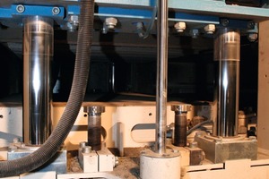  Fig. 1 Vibration table and tamper head of the block machine. 