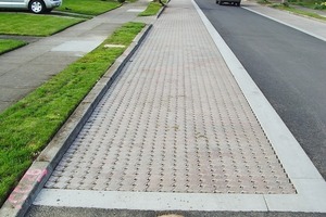  Fig. 10 Capped, 4 ft (1.2 m) deep, 6 in. (150 mm) diameter perforated pipes serve as wells to monitor infiltration rates.  