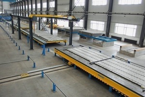  The precast floor slabs are lifted in horizontal position for ­being transported into the outdoor storage area by means of transport racks using a run-off carriage with side-shifter 