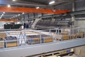  Fig. 3 The reinforcement works are carried out on the mezzanine floor of the hall. The completed mesh reinforcement and cages are lowered into the formwork from above. 