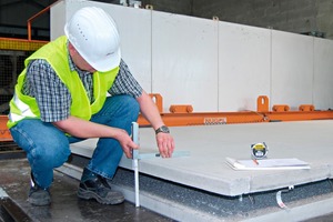  Fig. 1 At the precast concrete factory of Bad Dürkheim: Ralf Meyer, responsible for the quality management, when measuring the double wall element.  
