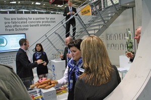  Fig. 5 At the booth of Vollert Anlagenbau GmbH &amp; Co. KG the presentation on the production line model was rounded off by pretzels and champagne.  
